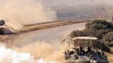 Israeli tanks rolling along the border between Israel and the Gaza Strip on Wednesday