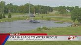 WATCH: Car crashes into pond, leads to water rescue