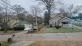 Tree splits down the middle before falling on 2 East Point homes