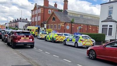 Emergency crews block road after elderly woman knocked down by car