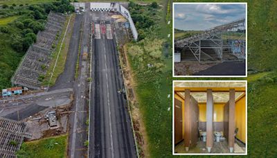 Inside abandoned race track left to rot with weeds growing in grandstand