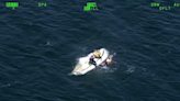 Video: Calif. sheriff's office helicopter team saves 2 people clinging to boat after it capsizes