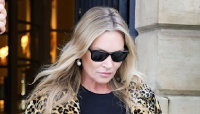 Kate Moss wears a trademark leopard print fur coat in Paris