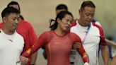 China track cyclist Yuan Liying has to be helped off velodrome after causing hard keirin crash