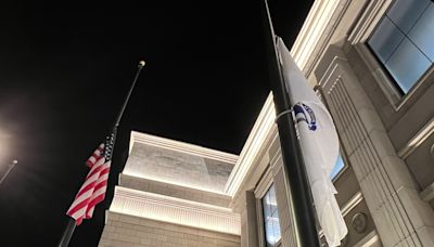 Why are flags at half-staff in Massachusetts ahead of Fourth of July?