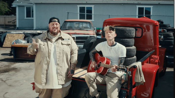 MGK & Jelly Roll Channel John Denver In Their ’Lonely Road’ Video