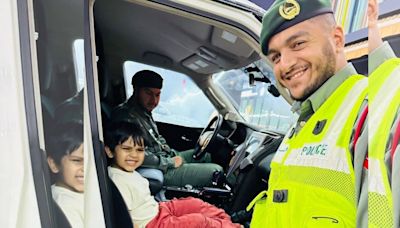Dubai Police helps a child obsessed with police cars to complete his dream