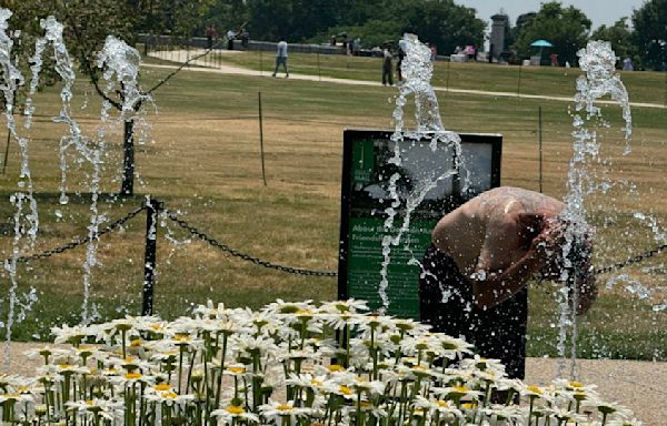 ‘Catastrophic flooding’ in Upper Midwest prompts evacuations as record-breaking heat wave broils the West and mid-Atlantic