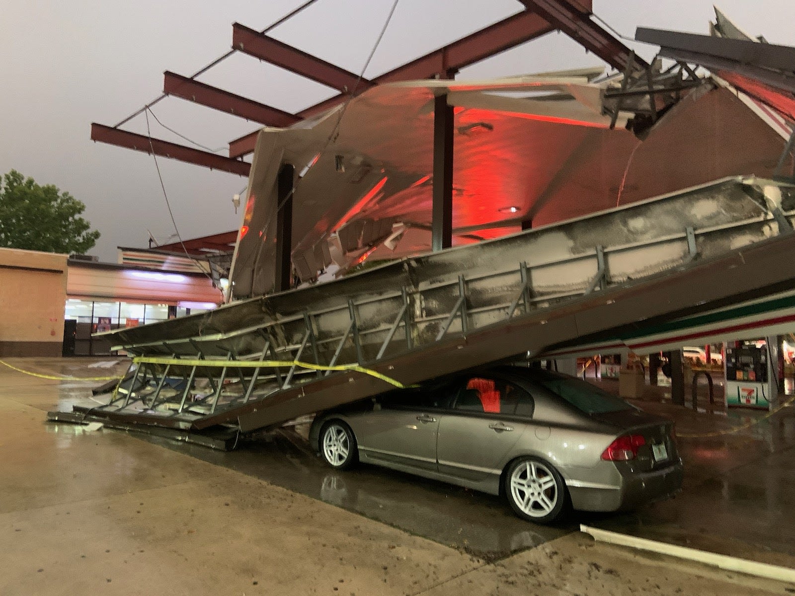 Florida thunderstorm knocks gas station canopy onto car near Orlando