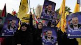 Iran’s supreme leader prays over the coffin of Hamas leader Haniyeh, whose killing risks a wider war