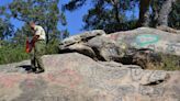 Los Padres firefighters scrub away Nazi graffiti on SLO County rock formation