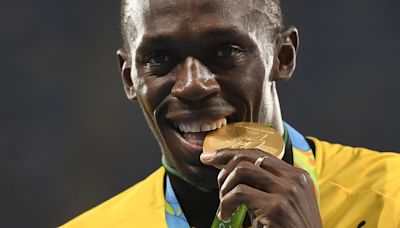 Revealed: The reason why athletes BITE their medals after winning