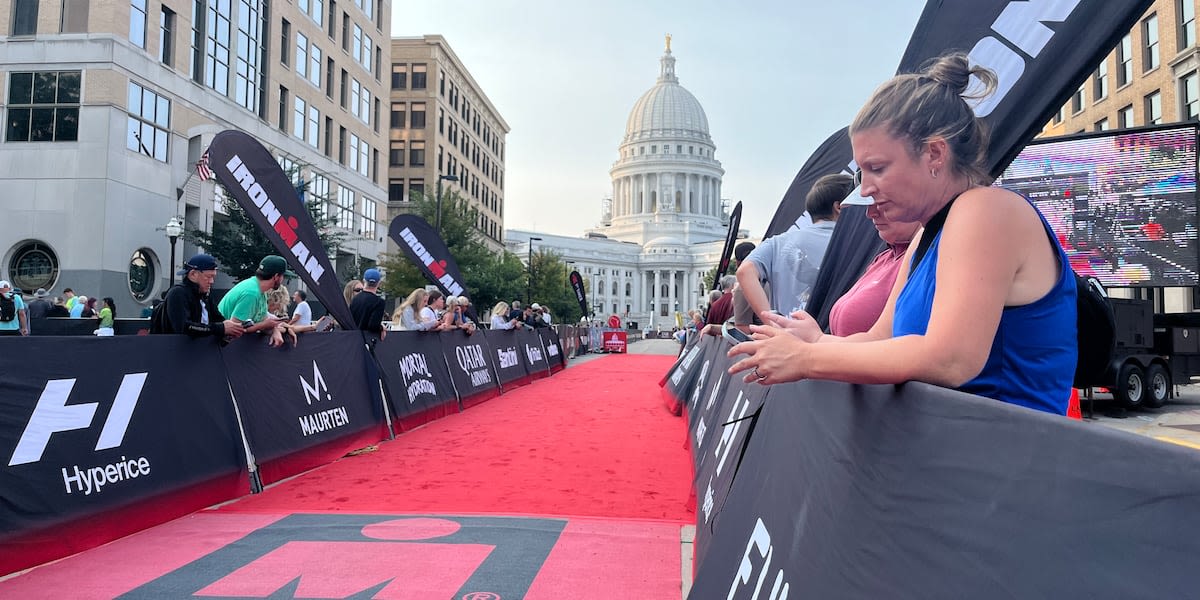 Families support Ironman athletes as they cross the finish line in Madison