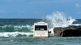 Sea scoops up ice cream van after it gets stuck in sand on beach