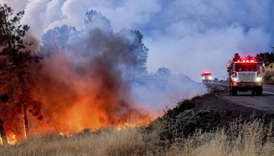 Suspect arrested over California fire sparked by burning car pushed into gully