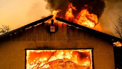 Northern California wildfire spreads, with more hot weather expected