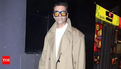 Karan Johar turns heads at Mumbai airport in a stylish trench coat | Hindi Movie News - Times of India
