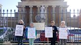 Juries conscience group protests outside courthouses with placards