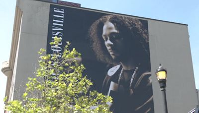 Hometown Hero banner unveiled for Static Major in downtown Louisville