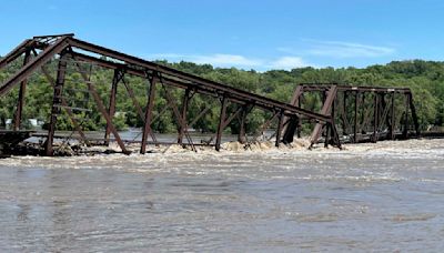 Midwestern flooding collapses a bridge, forces evacuations and kills at least 2