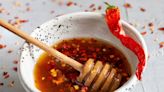 Hot honey is the sweet and spicy flavor on everyone's lips, from pizza to cocktails. Here's why it's America's newest food obsession.