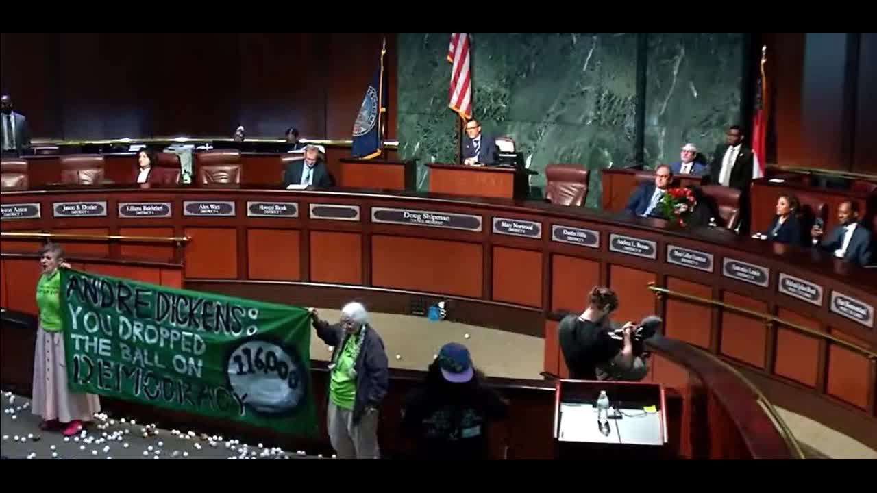 Stop Cop City protesters throw ping pong balls during Atlanta City Council meeting