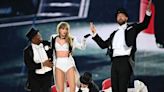 Travis Kelce Joins Taylor Swift on Stage for Surprise ‘Eras Tour’ Appearance and Literally Sweeps Her Off Her Feet