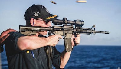 US Navy warship commander relieved of duty following image of him shooting rifle with scope mounted backward