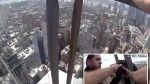 NYPD detectives jump over glass barrier to save distraught woman on ledge of 54-story NYC building, dramatic video shows