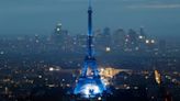 Eiffel Tower glows on rainy night, but many fans can't see opening ceremony