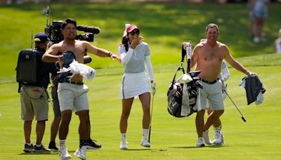 Watch: Two US caddies take tops off at Solheim Cup