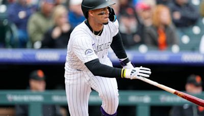 Rockies erupt for 7-run inning, beat Giants 9-1