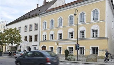 Four people caught laying white roses outside Adolf Hitler’s birthplace