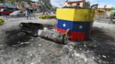 Hugo Chavez statues toppled across Venezuela in post-election unrest