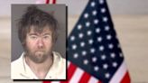 Suspect charged after being accused of assaulting victim with American flag