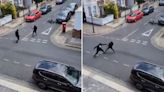 Terrifying moment thugs armed with Rambo knives fight in city street