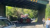 Car transporter crashes into Tunbridge Wells railway bridge leaving debris and battered cars