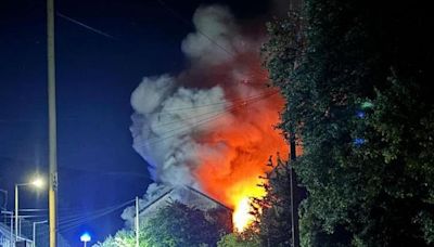 Road shut in both directions after large fire at former pub