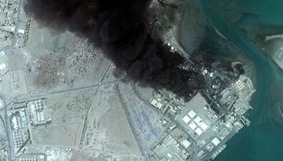 Yemeni port still burning days after Israeli air strikes
