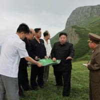 Kim Jong Un (C) has poured huge resources into developing the Samjiyon area, with the vast project including new apartments, hotels and a ski resort