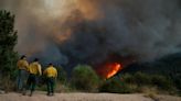 Residents flee as California and Nevada wildfires get dangerously close and forecasters warn of record heat