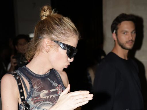 Stella Maxwell leaves her hotel with a mystery man during PFW