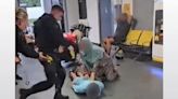 Police watchdog opens criminal investigation into officer filmed kicking man at Manchester Airport