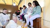 Tears flow as pope washes feet of women inmates at Rome prison