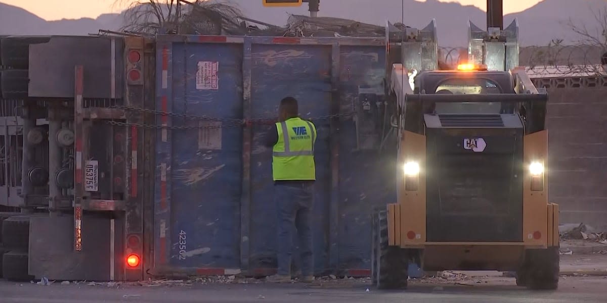 Overturned truck spills garbage onto road, causes delays in northeast Las Vegas