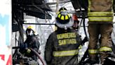 Bomberos trabaja para contener incendio en locales del barrio Meiggs - La Tercera