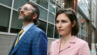 Tearful Amanda Knox says she is 'a victim' and vows to fight slander re-conviction