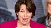 People Are Calling This Picture Of Amy Klobuchar With Hot, Shirtless Firefighters The Most Relatable Thing She's Ever Done