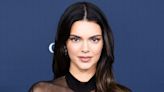 Kendall Jenner Flaunts Tight Torso Under Feathered Capelet