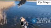 Watch: Ukrainian angler hurls fish at Russian drone